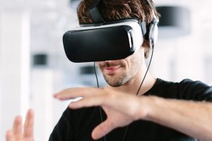 man-using-virtual-reality-simulator-headset
